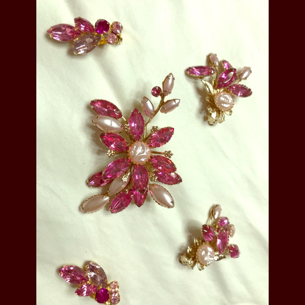Pink crystal brooch with two pair clip earrings.